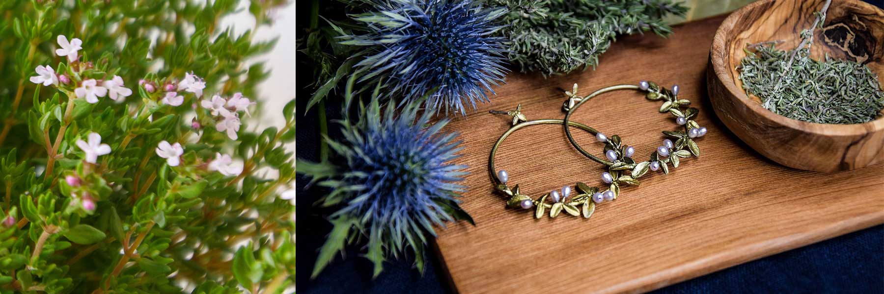 Close-up of thyme flowers on the left; on the right, gold earrings with leaf and pearl details are displayed on a wooden tray with dried herbs and spiky blue thistle flowers.