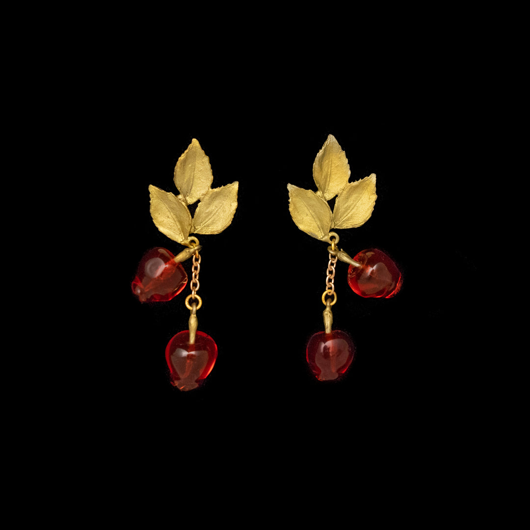 Image of the Michael Michaud Delicious Apple Earrings - Drop Post on a black background