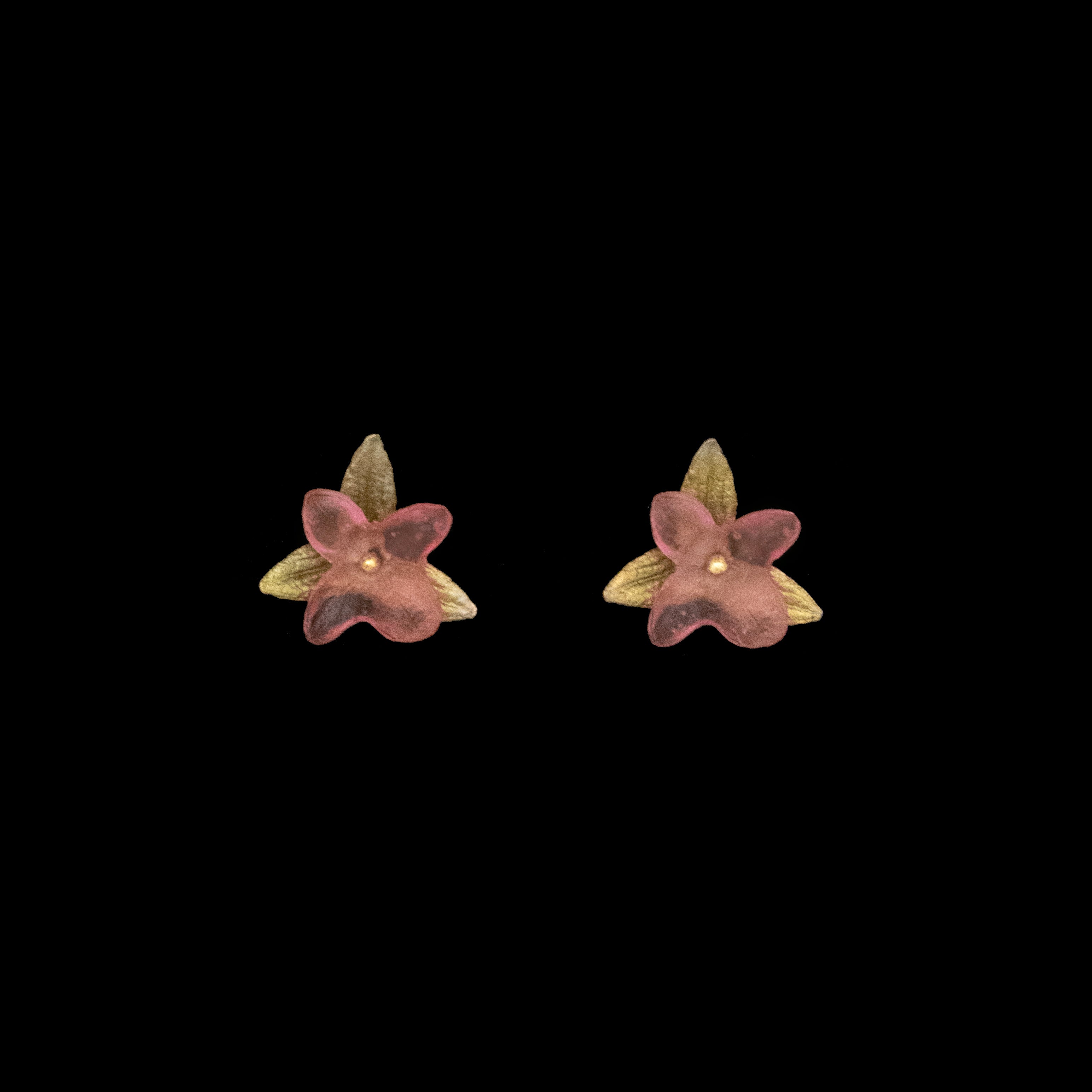 Image of the Michael Michaud Pink Hydrangea Earrings - Post Pink on a black background