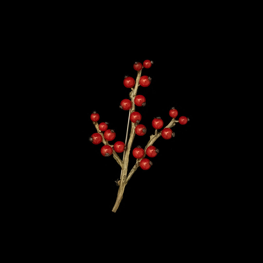 Image of the Michael Michaud Winterberry Brooch on a black background