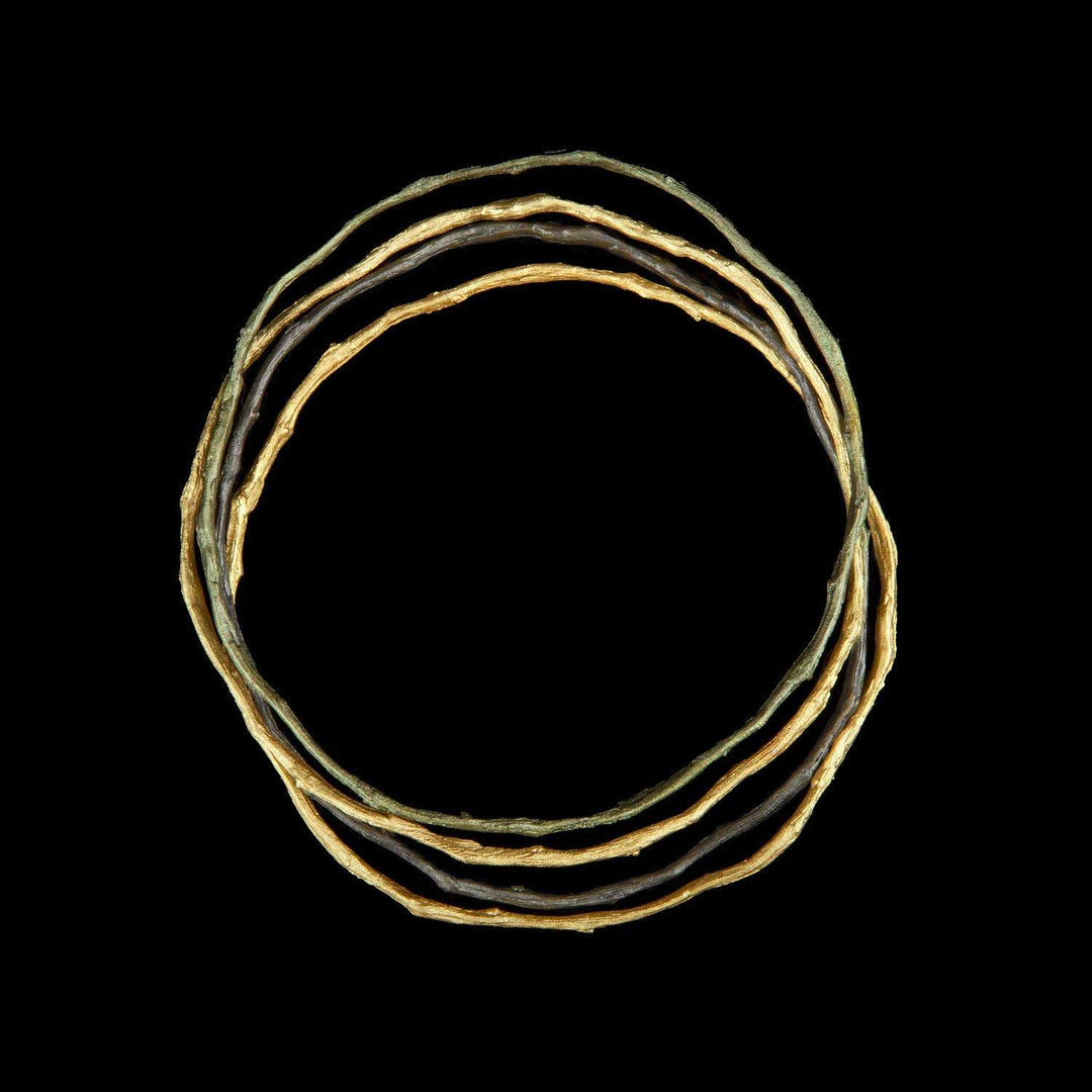 Image of the Michael Michaud Petite Driftwood Bangles (Set of 4) on a black background