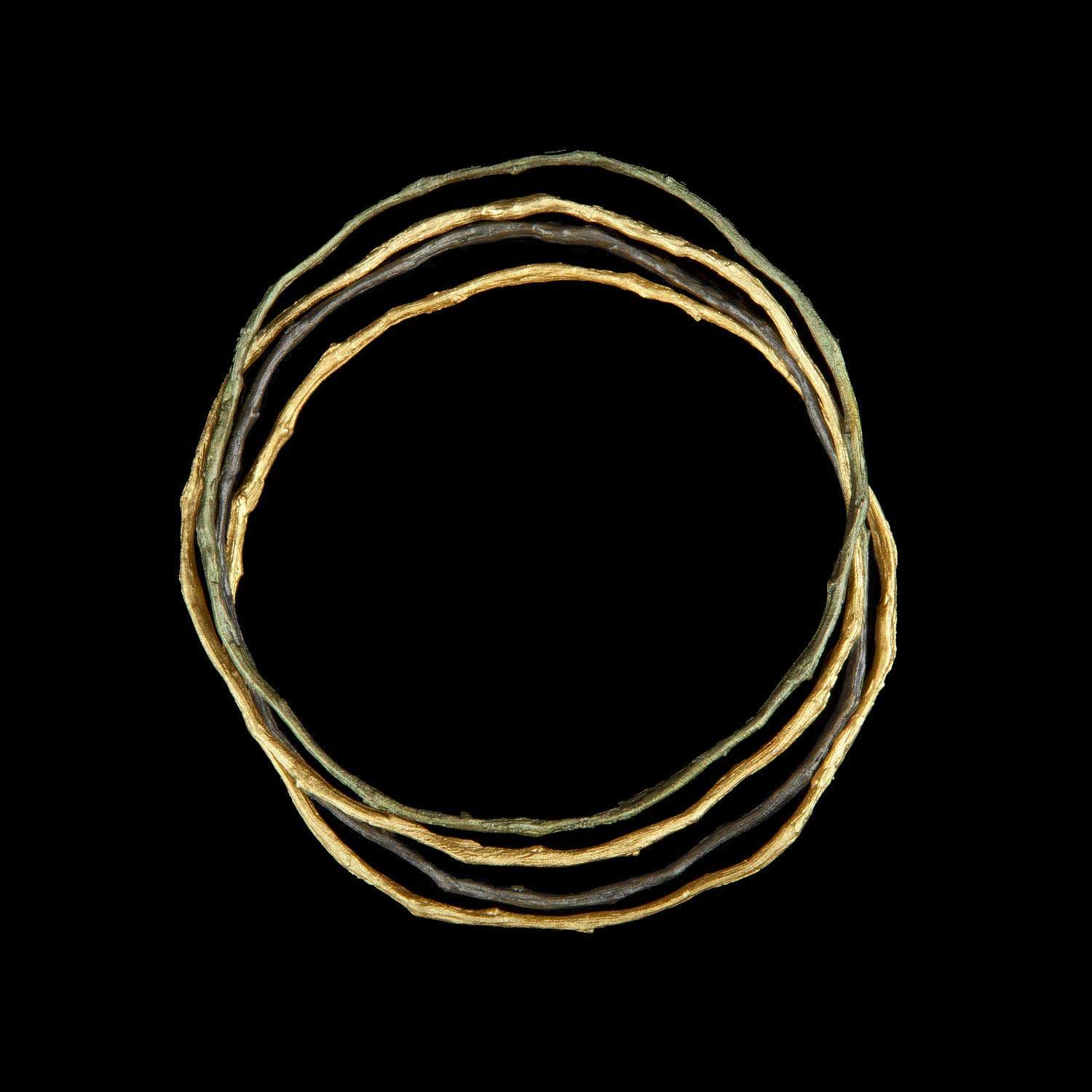 Image of the Michael Michaud Petite Driftwood Bangles (Set of 4) on a black background