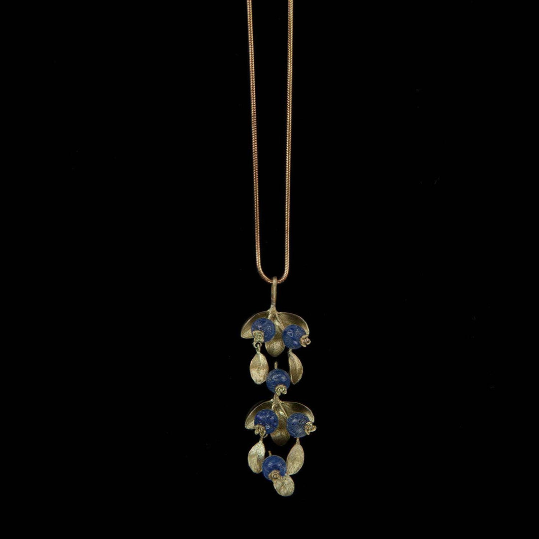Image of the Michael Michaud Blueberry Pendant on a black background