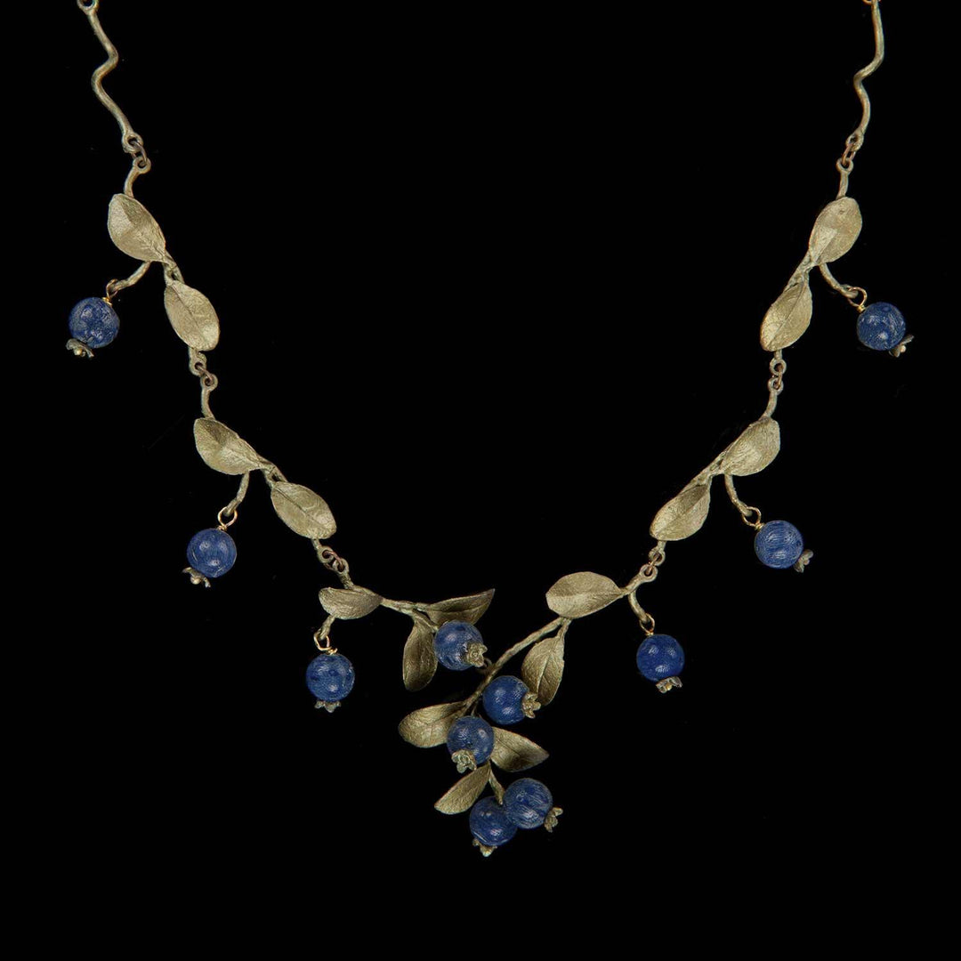 Image of the Michael Michaud Blueberry Necklace - Twigs on a black background