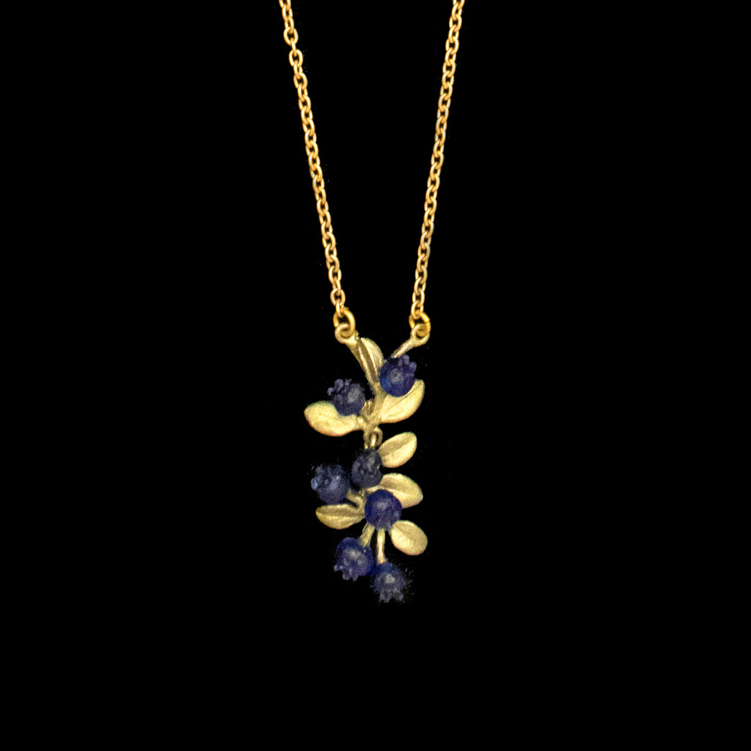 Image of the Michael Michaud Petite Blueberry Pendant on a black background