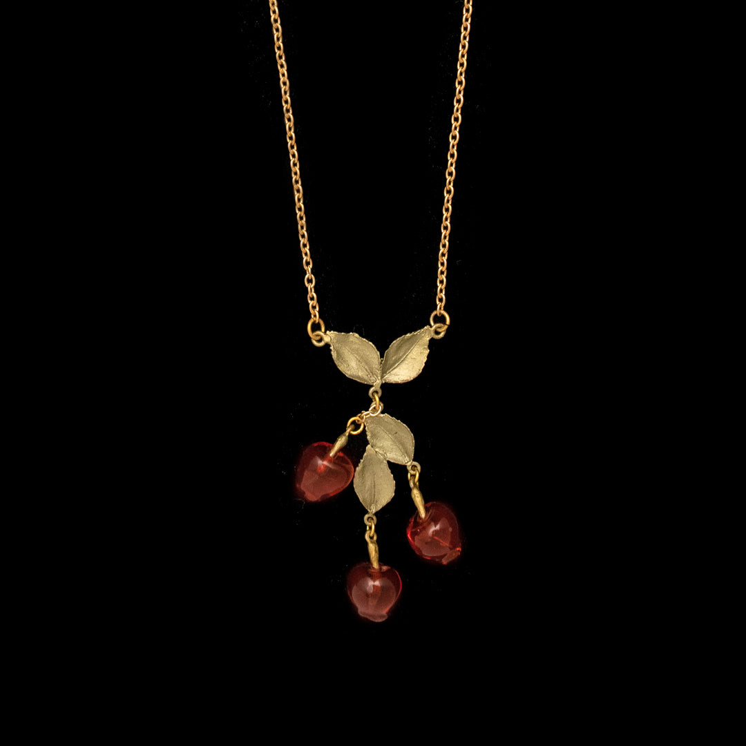 Image of the Michael Michaud Delicious Apple Pendant - 3-Drop on a black background