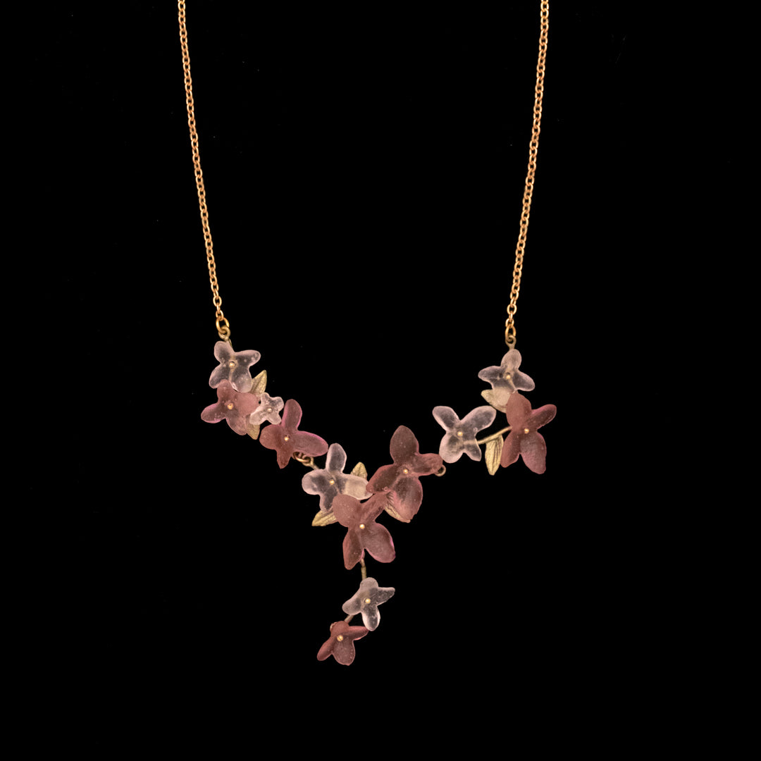 Image of the Michael Michaud Pink Hydrangea Necklace on a black background