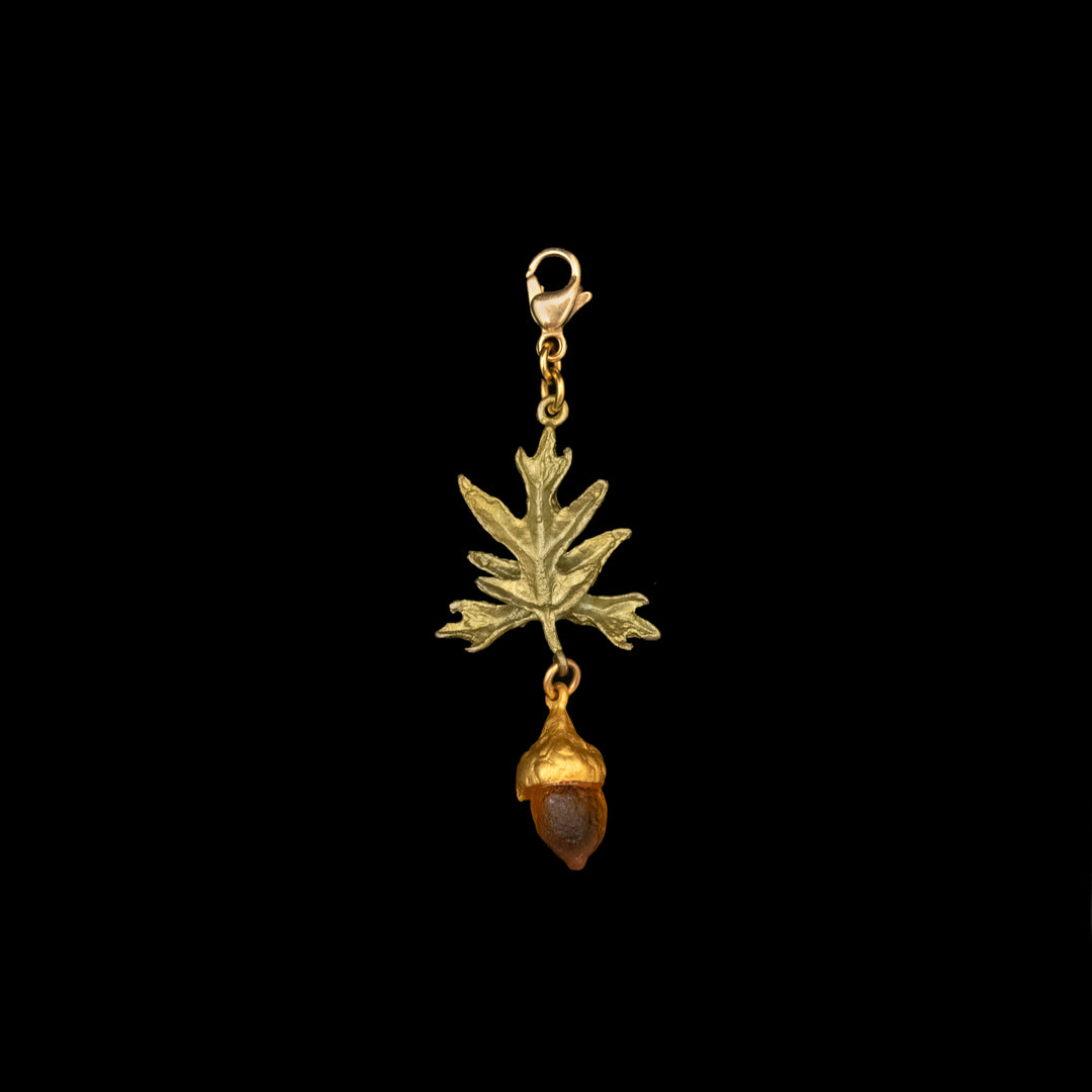 Image of the Michael Michaud Pin Oak Charm on a black background