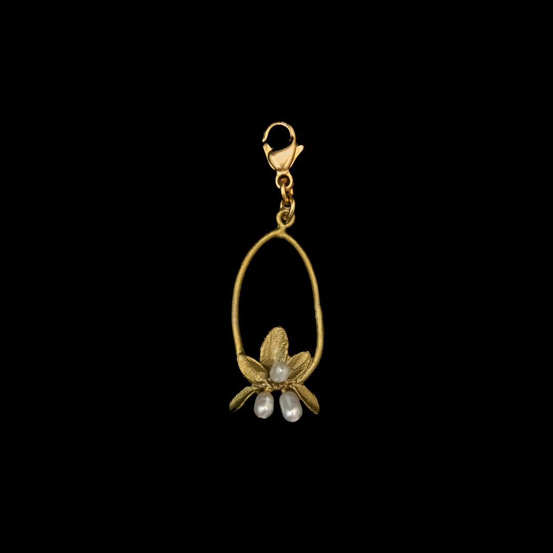 A green flowering thyme charm with a lobster clasp, featuring an oval loop, three freshwater pearls, and a decorative leaf motif at the base.