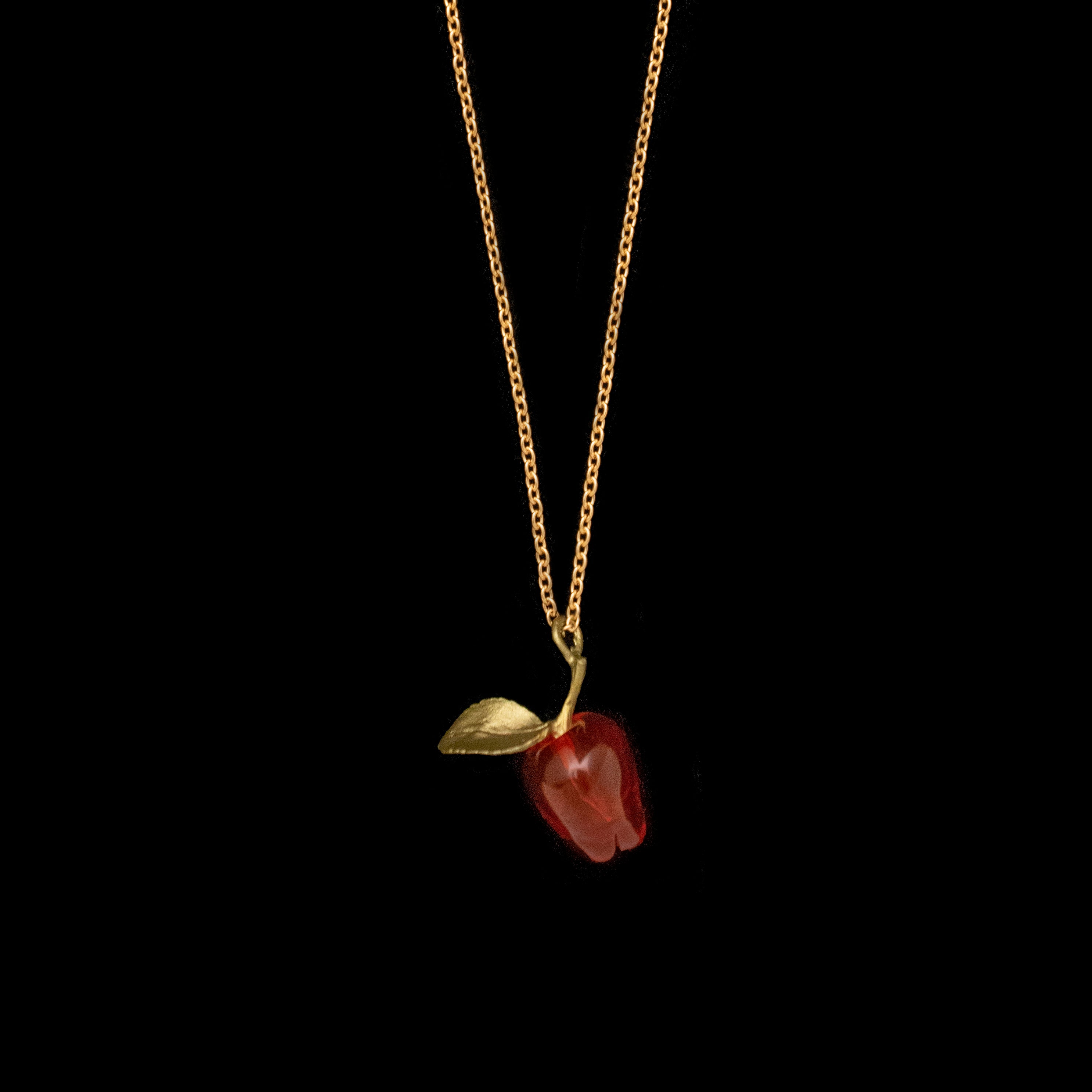 Image of the Michael Michaud Delicious Apple Pendant on a black background