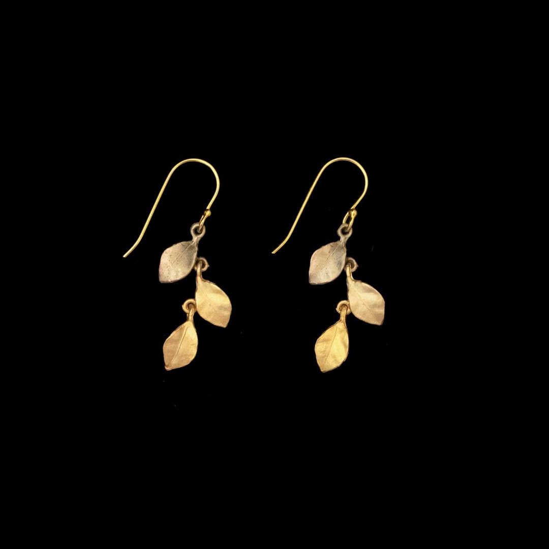 The Golden Autumn Earrings - Dainty Wire feature 24kt gold plating and three delicate leaves on each earring, displayed on a solid black background—ideal for adding an elegant seasonal touch to your autumn look.