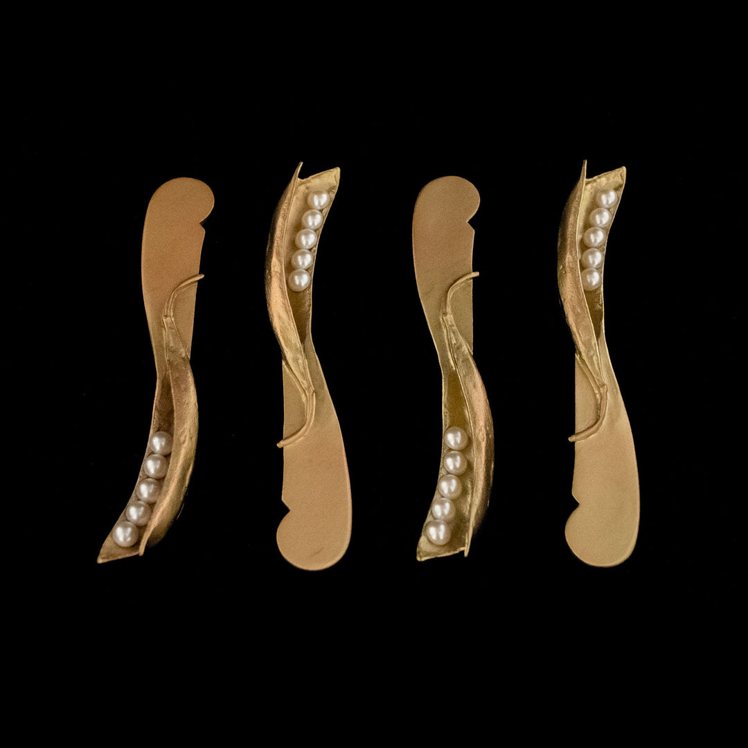 Image of the Michael Michaud Pea Pod 4 Piece Cheese Spreader Set on a black background