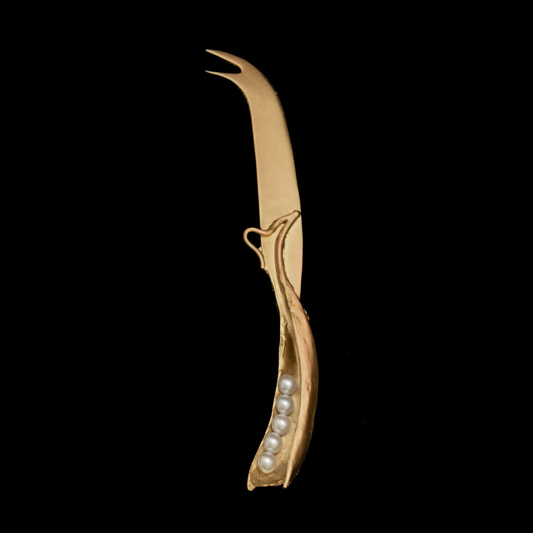 Image of the Michael Michaud Pea Pod Fork Tipped Knife on a black background