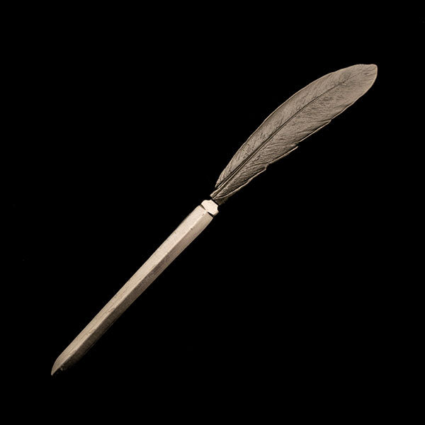 Image of the Michael Michaud Feather Letter Opener on a black background
