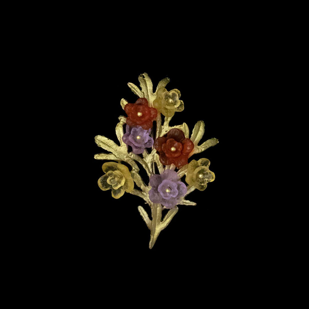 Image of the Michael Michaud Mums Brooch on a black background
