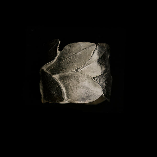 silver leaf napkin ring on a black background