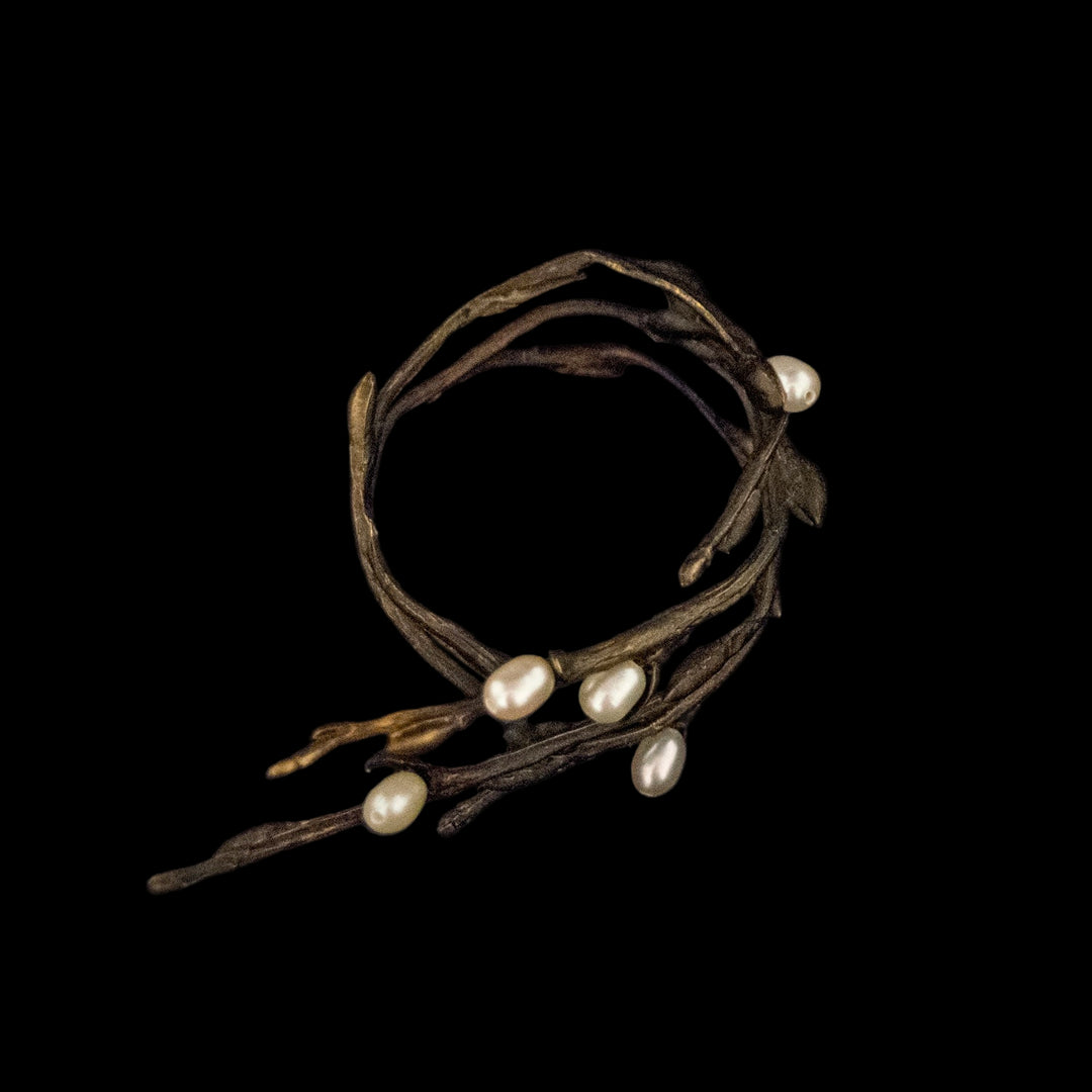 Image of the Michael Michaud Pussy Willow Napkin Rings on a black background
