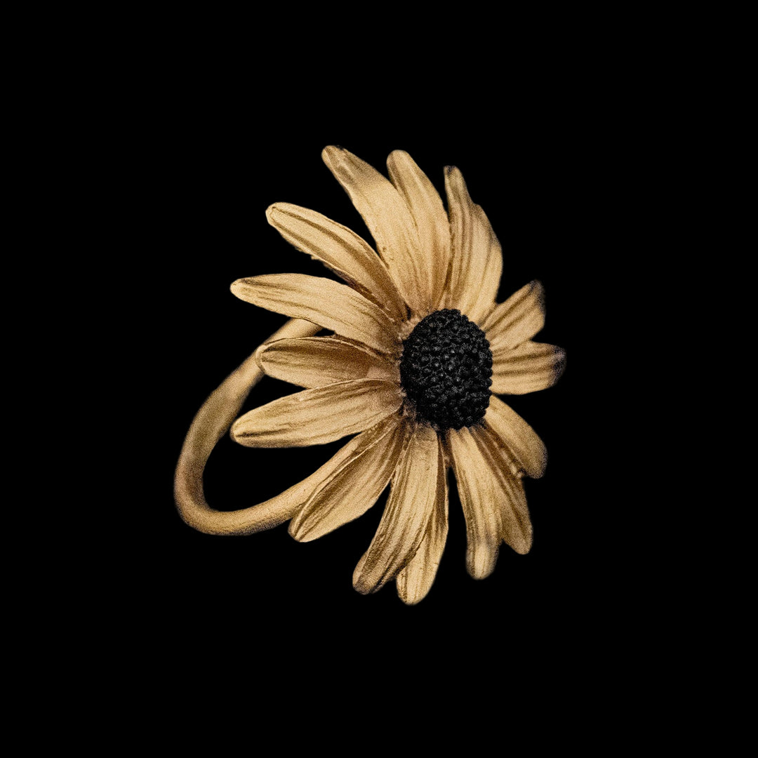 Image of the Michael Michaud Black-Eyed Susan Napkin Rings on a black background