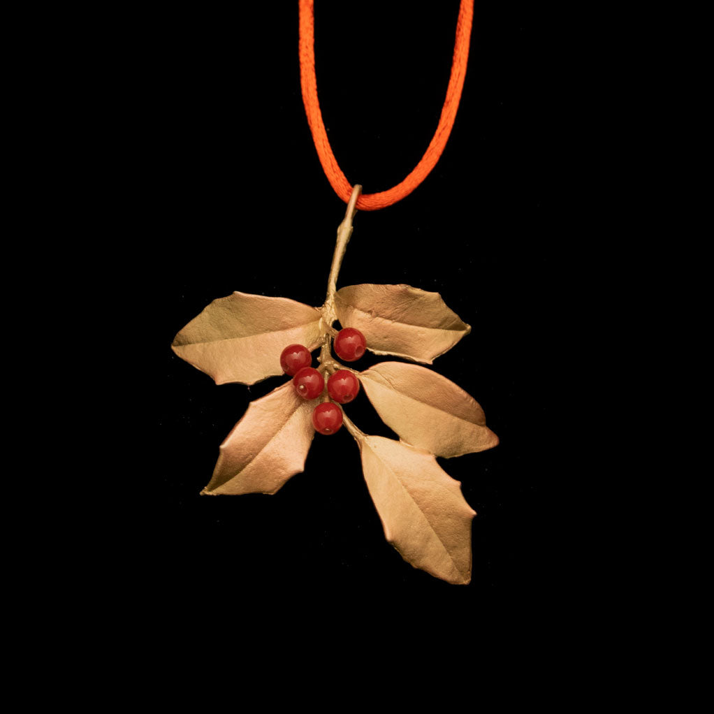 Image of the Michael Michaud Holly Ornament on a black background