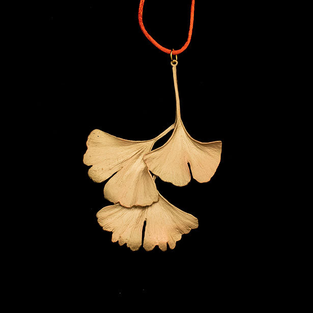 Image of the Michael Michaud Ginkgo Leaf Ornament on a black background