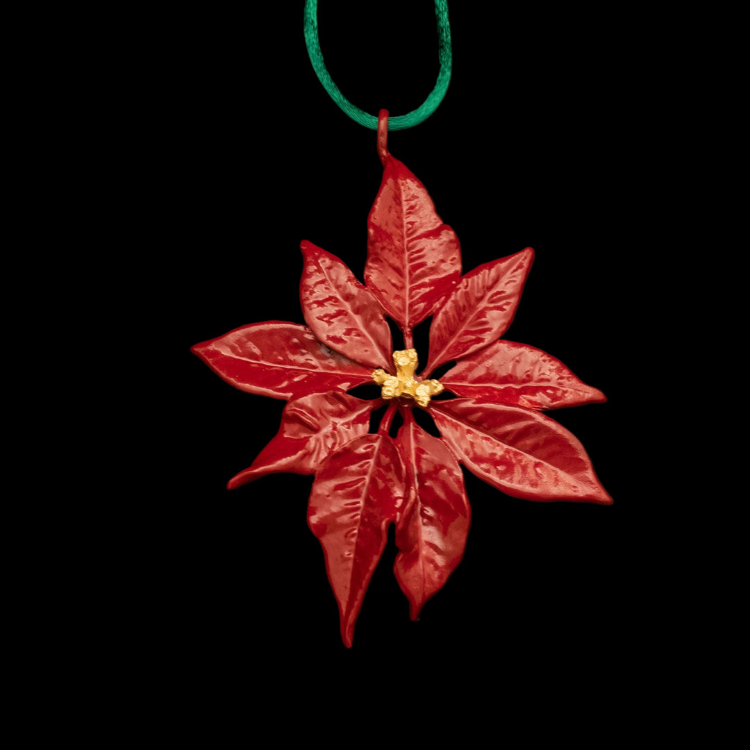 Image of the Michael Michaud Poinsettia Ornament on a black background