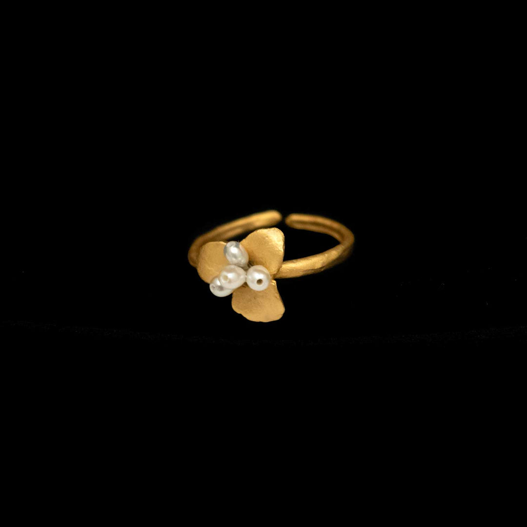 Image of the Michael Michaud Pachysandra Ring on a black background