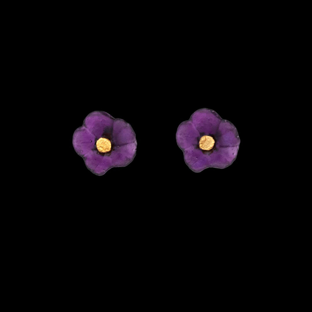 Pair of purple Petunia earrings with yellow centers on a black background, showcasing nature-inspired artistry and the beauty of handcrafted jewelry.
