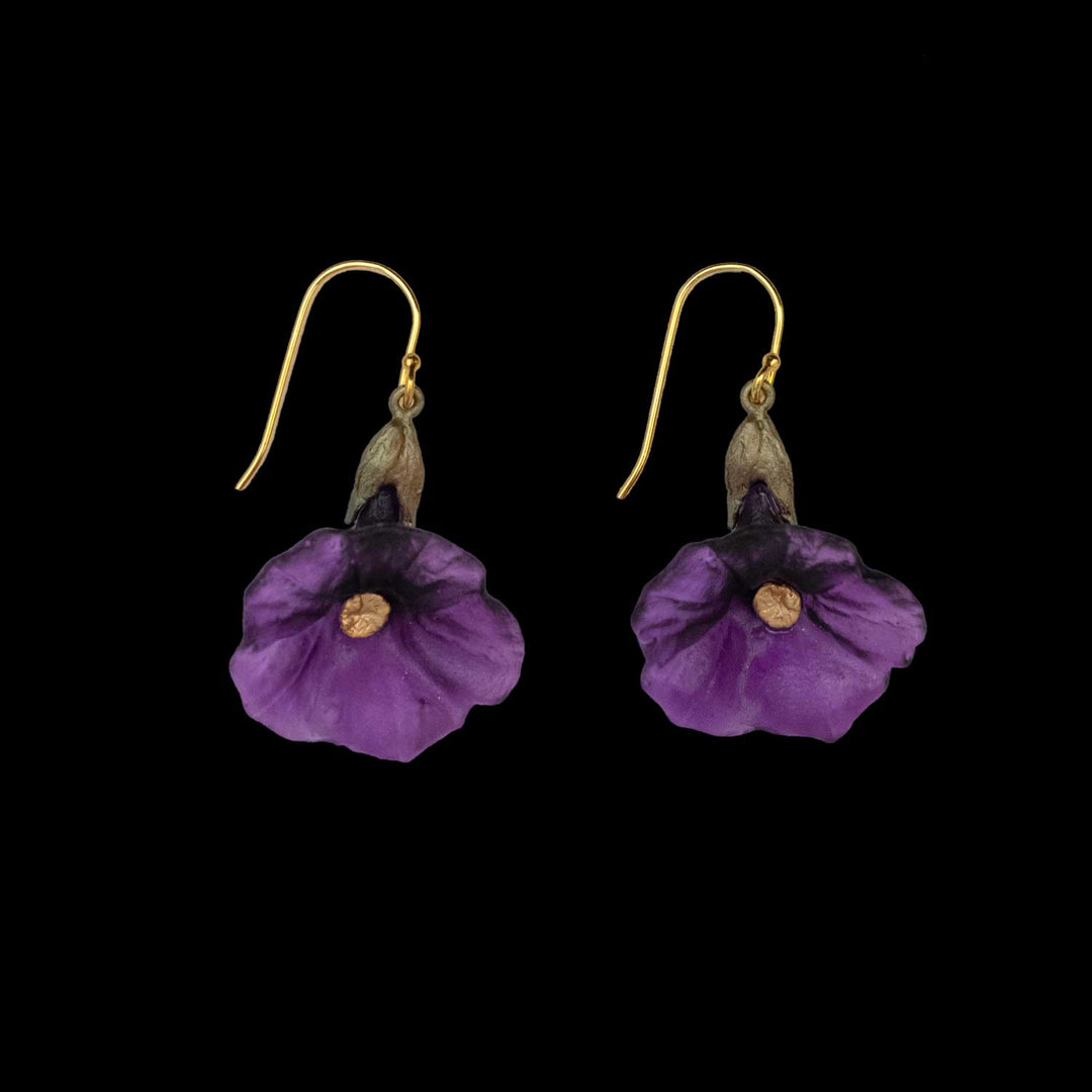 A pair of Petunia earrings featuring purple flower-shaped pendants with gold hooks, showcasing nature-inspired artistry, displayed against a black background.