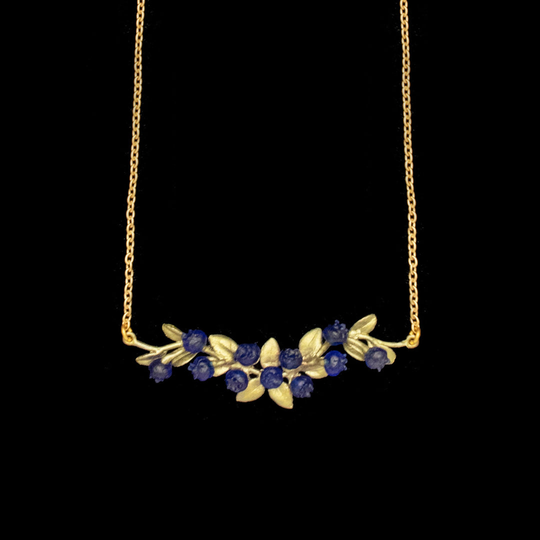 Image of the Michael Michaud Petite Blueberry Pendant - Bar on a black background