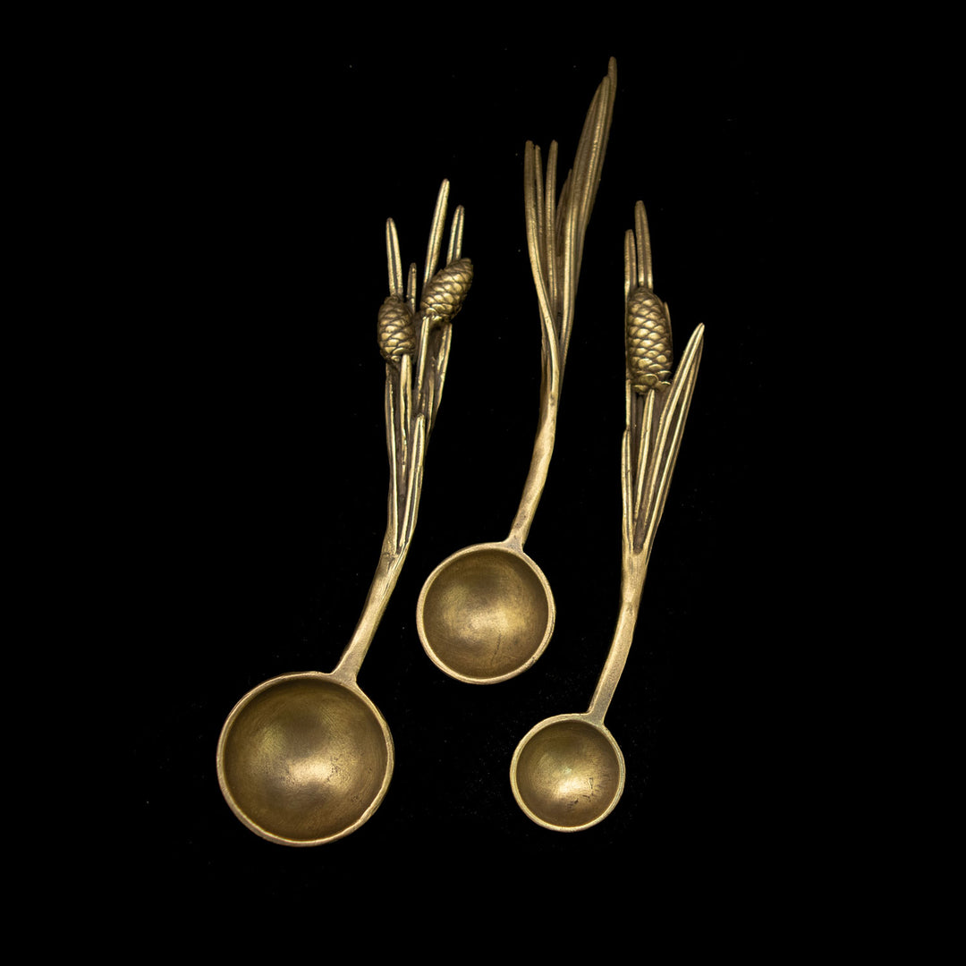 Image of the Michael Michaud Pine Nesting Spoons - Set of 3 on a black background