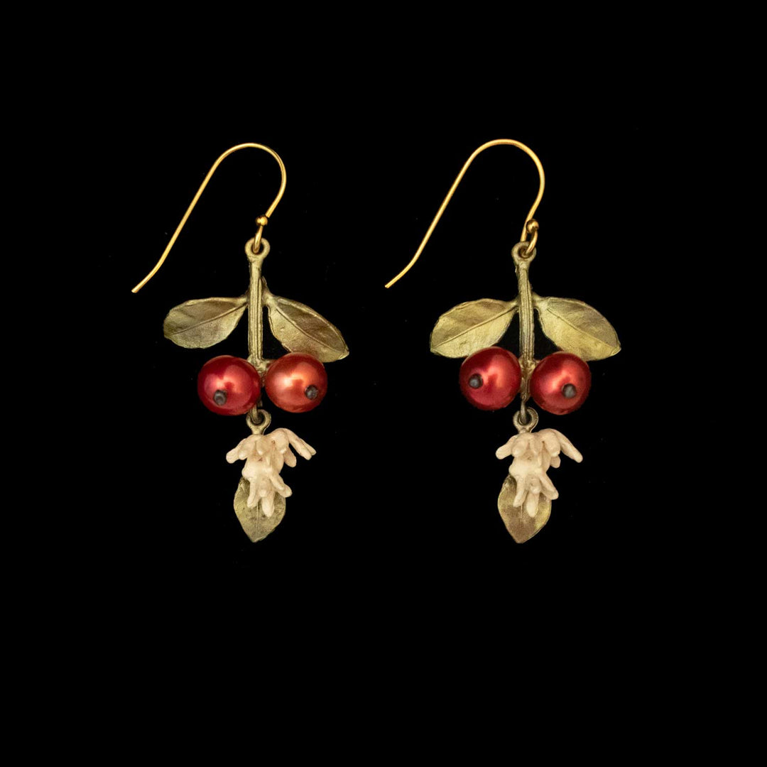 Unroasted Coffee Bean Earrings - Long Wire: Gold hook earrings featuring two red berry-like pearls, green leaves, all set against a black background.