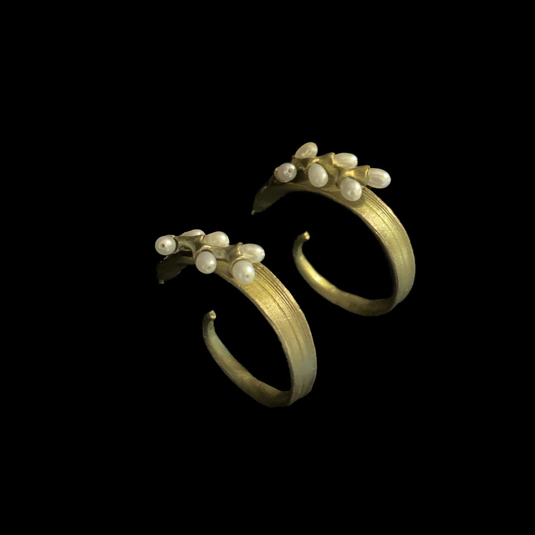 Image of the Michael Michaud Rice Earrings - Pearl Hoop Post on a black background