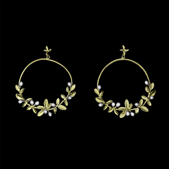 Image of the Michael Michaud Flowering Thyme Earrings - Hoop Post on a black background