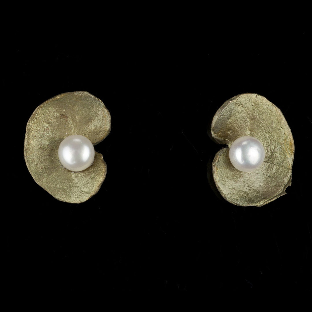 Image of the Michael Michaud Spiral Geranium Clip Earrings on a black background