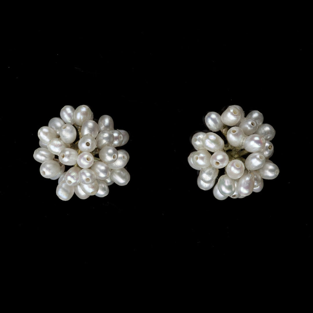 Image of the Michael Michaud Dandelion Earrings on a black background
