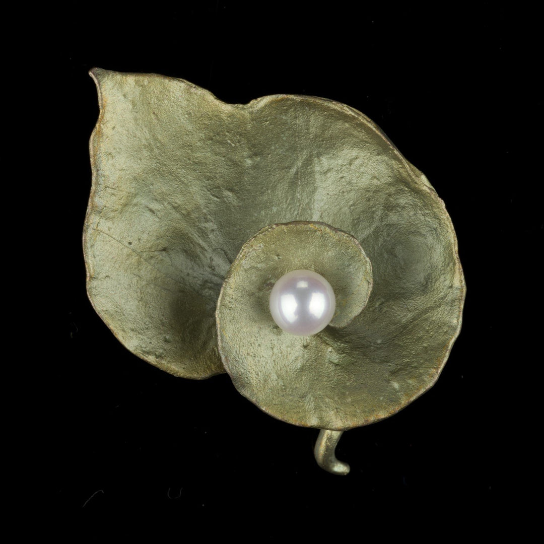 Image of the Michael Michaud Spiral Geranium Brooch on a black background