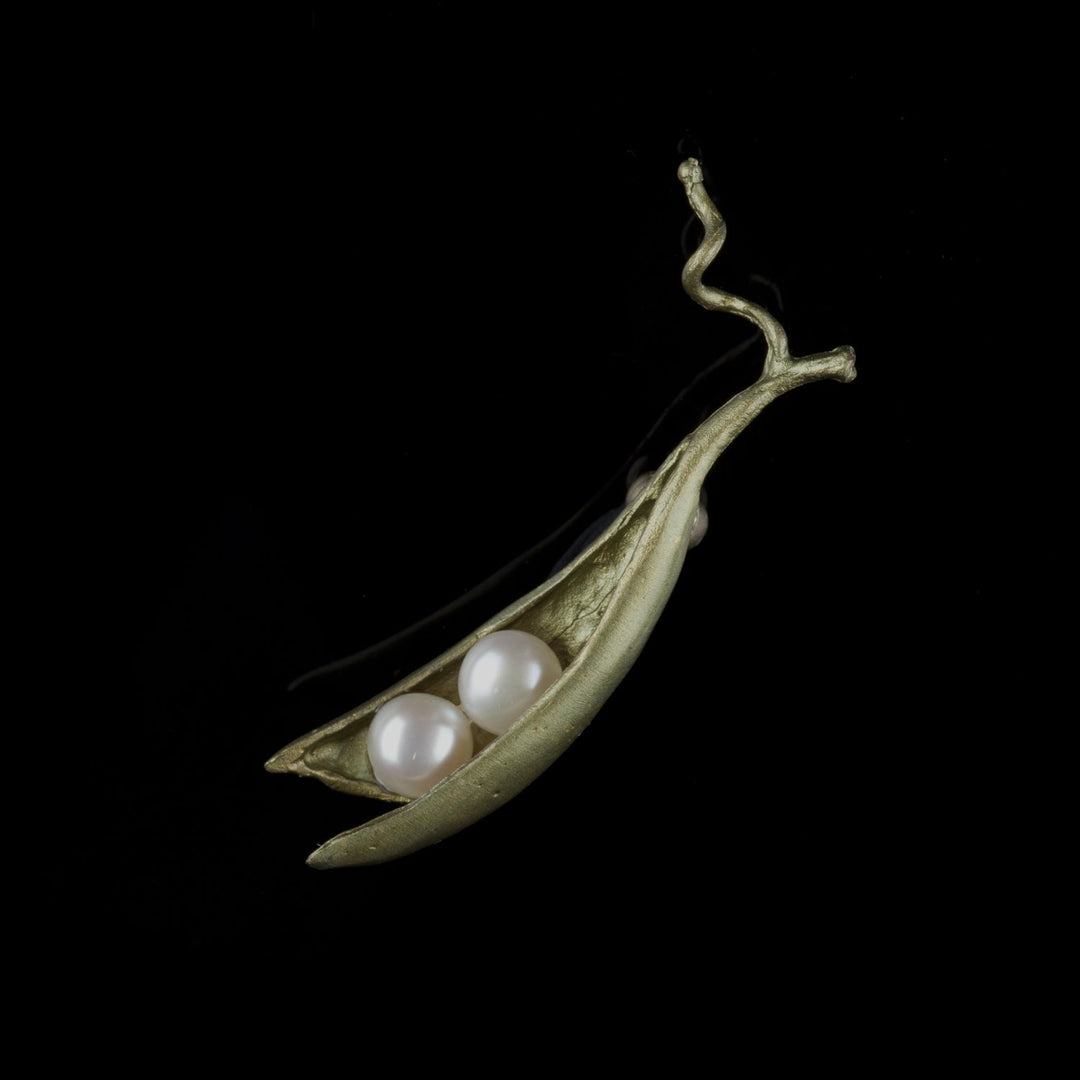Image of the Michael Michaud Pea Pod Brooch - 2 Pearls on a black background