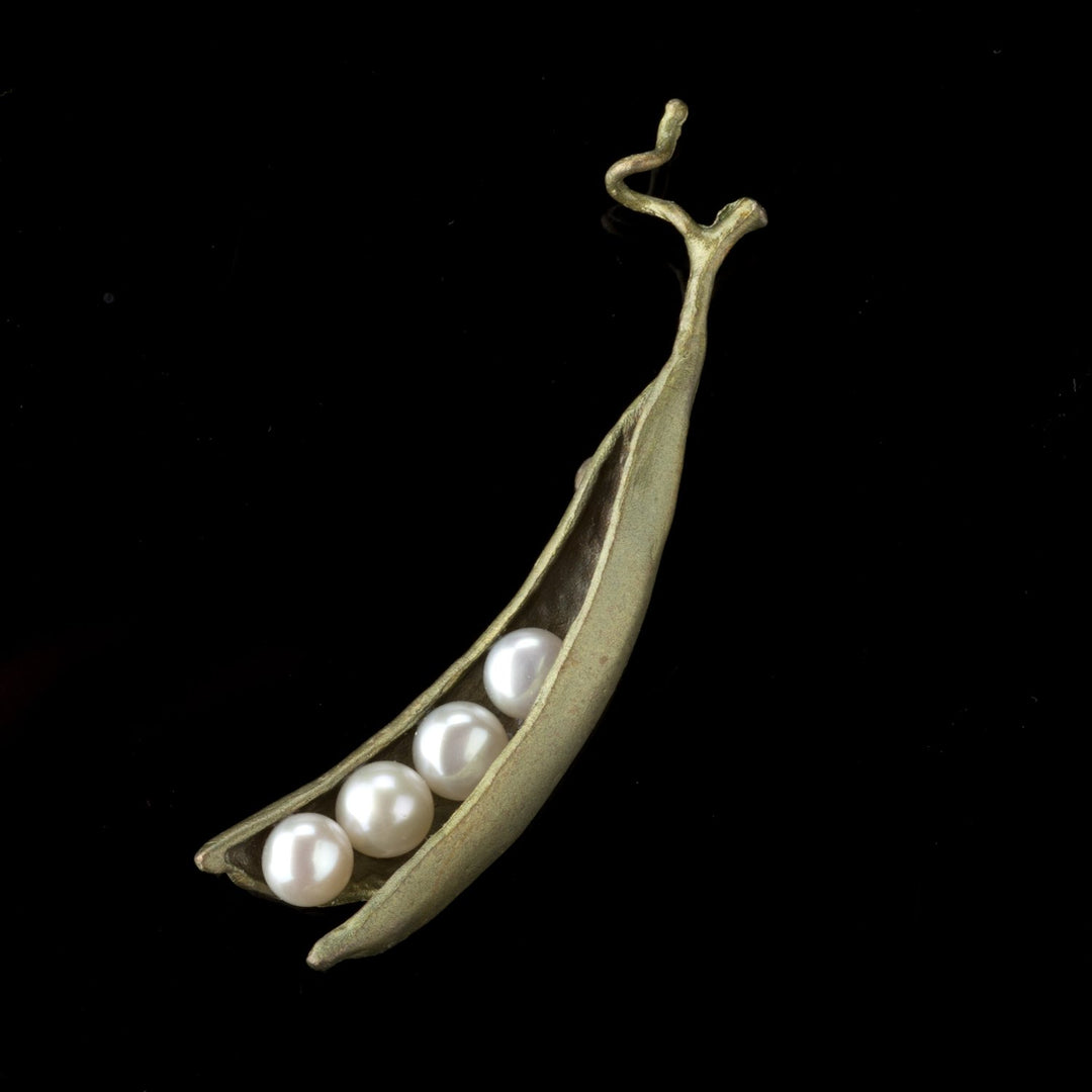 Image of the Michael Michaud Pea Pod Brooch - 4 Pearls on a black background
