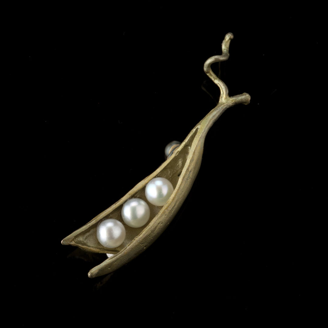 Image of the Michael Michaud Pea Pod Brooch - 3 Pearls on a black background