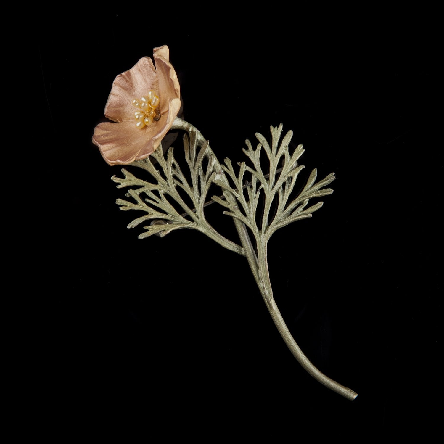 Image of the Michael Michaud California Poppy Brooch on a black background
