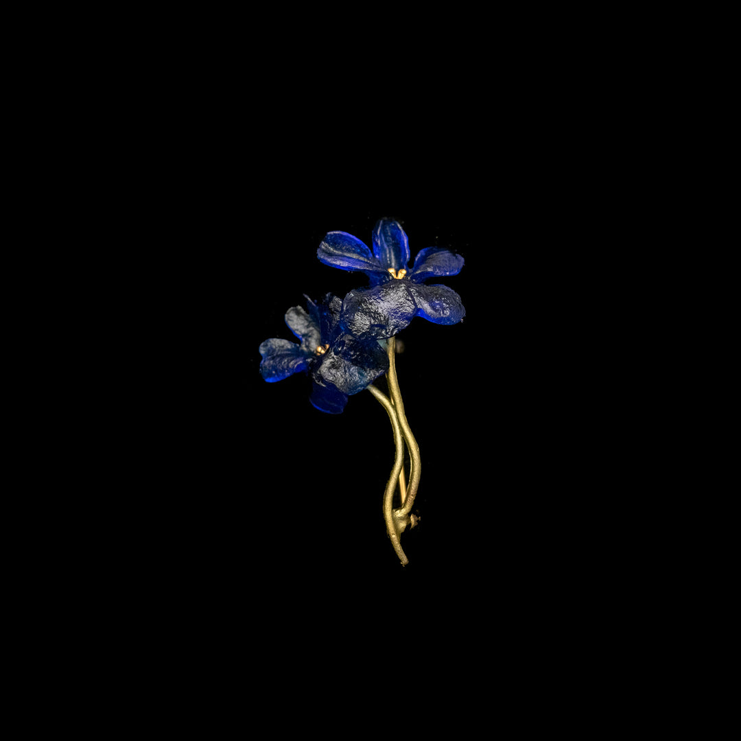 Image of the Michael Michaud Wild Violet Brooch on a black background