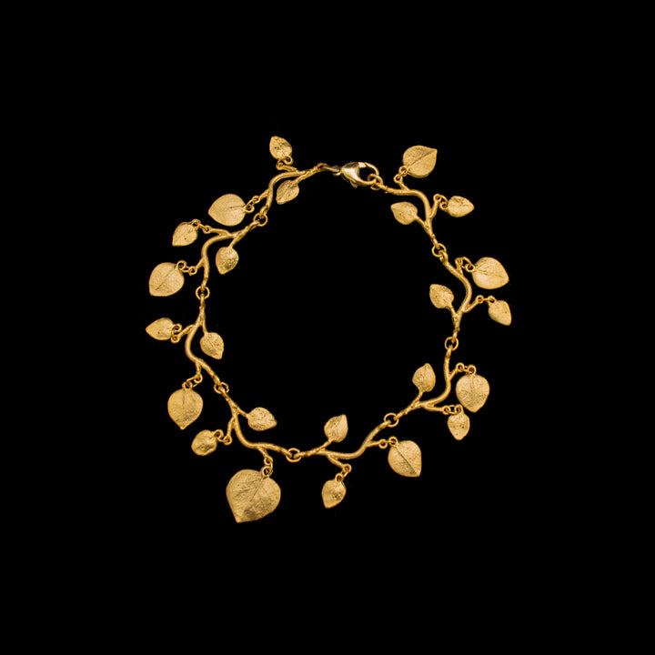 Image of the Michael Michaud Fine Eucalyptus Charm Bracelet on a black background