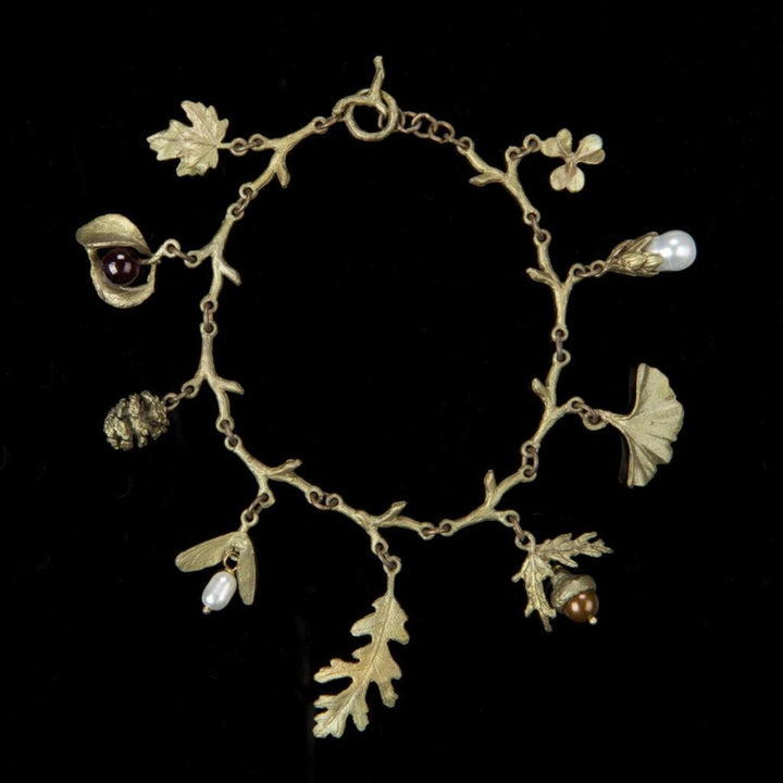 Image of the Michael Michaud Charm Bracelet on a black background