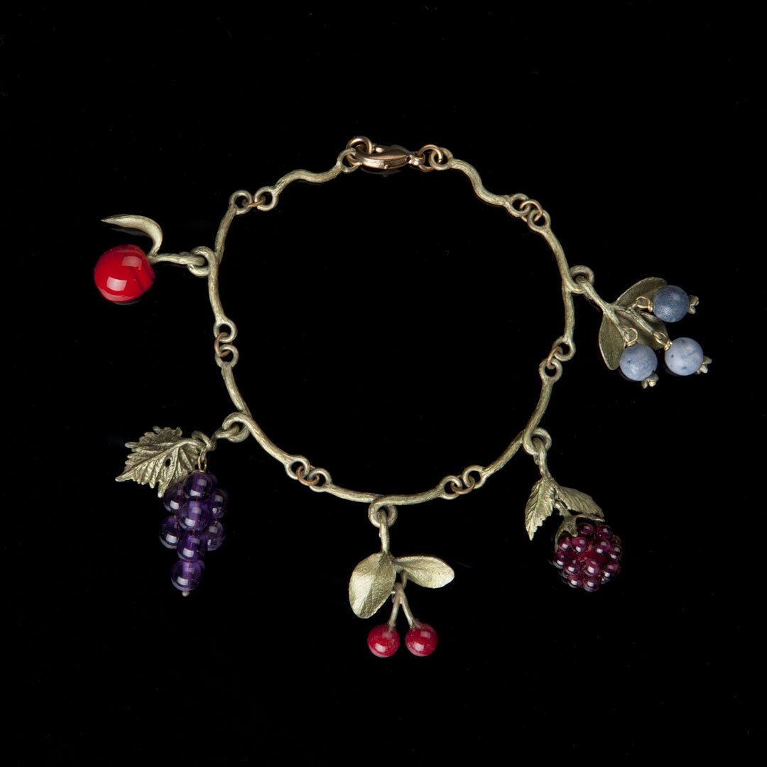 Image of the Michael Michaud Fruit Charm Bracelet on a black background