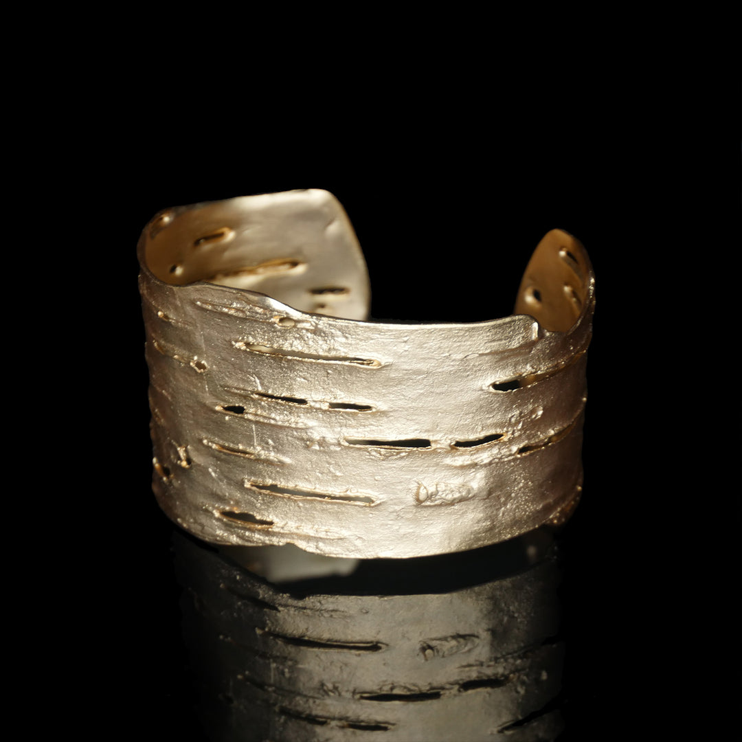 Image of the Michael Michaud Birch Bark Cuff - Gold on a black background