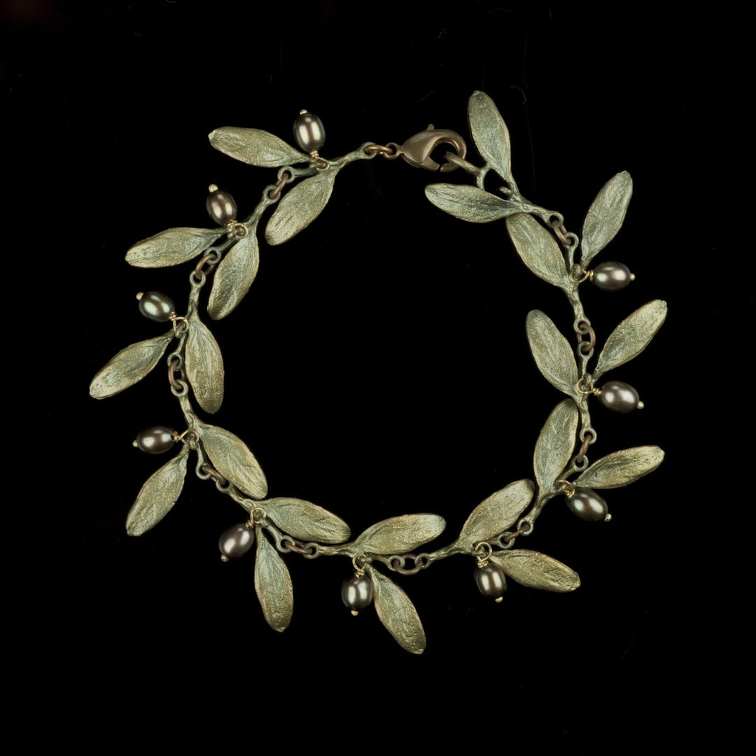 Image of the Michael Michaud Olive Bracelet on a black background