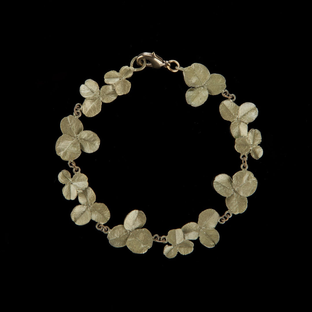 Image of the Michael Michaud Clover Bracelet on a black background