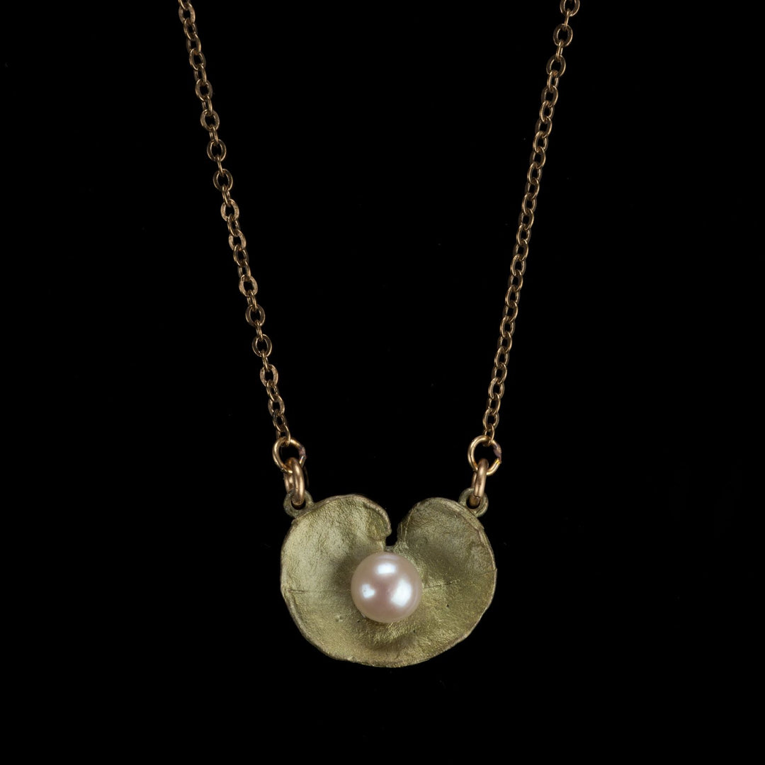 Image of the Michael Michaud Spiral Geranium Petite Pendant on a black background
