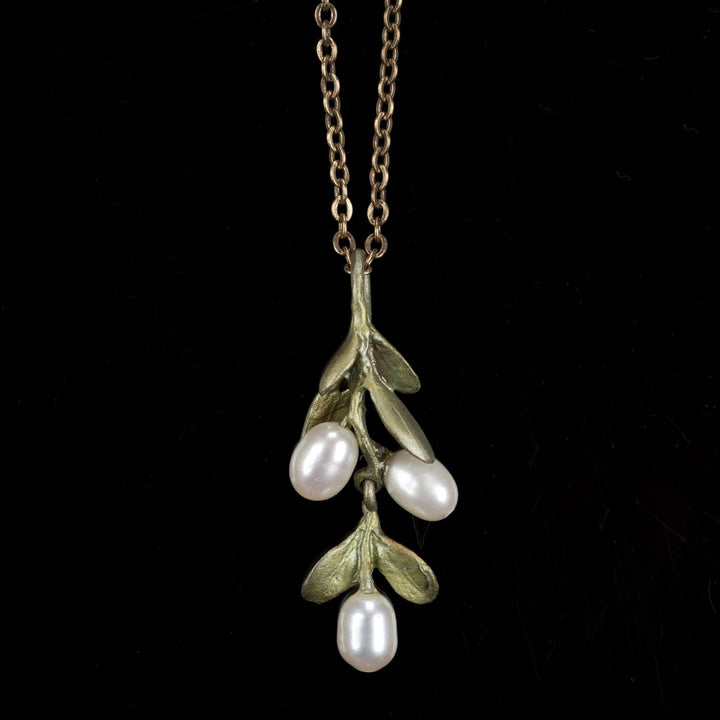 Image of the Michael Michaud Boxwood Pendant on a black background