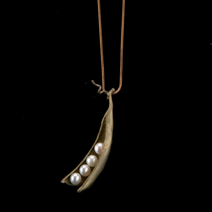Image of the Michael Michaud Pea Pod Pendant - 4 Pearls on a black background
